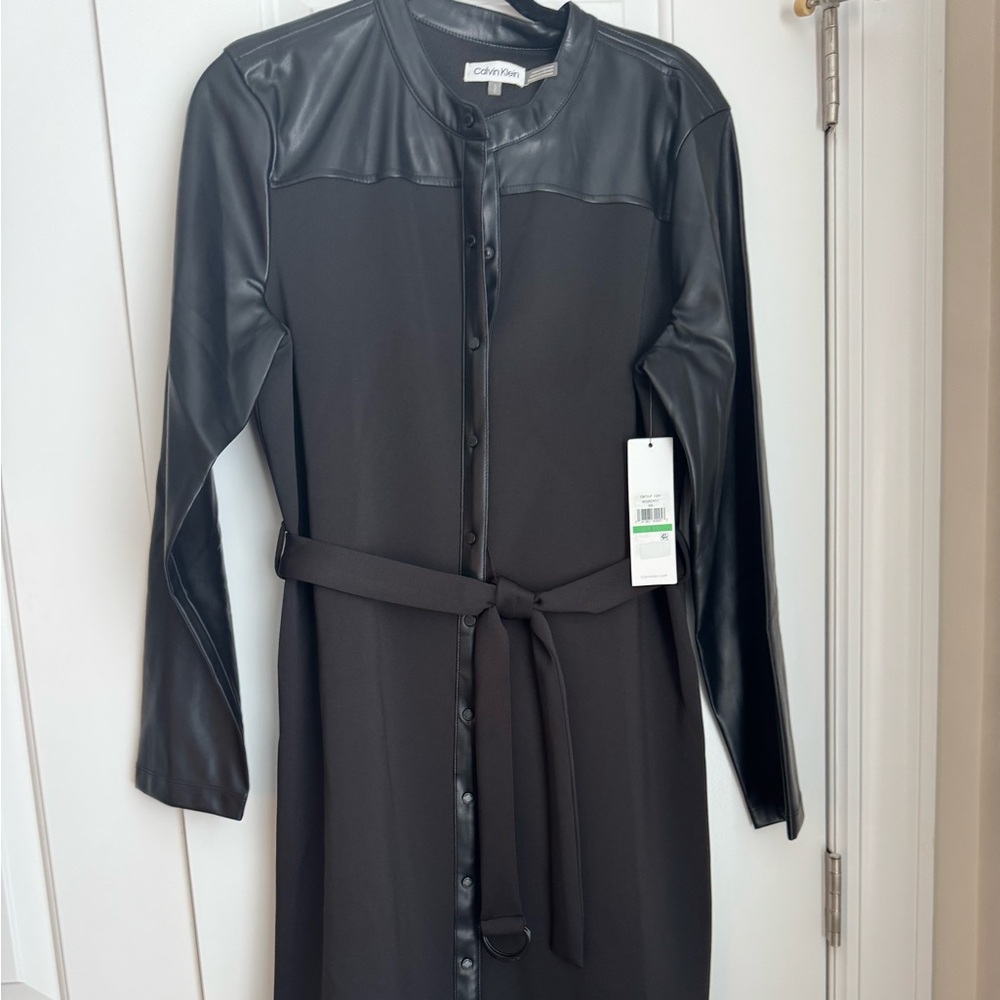 Black Calvin Klein shirt dress with faux leather accents. Women’s size large.